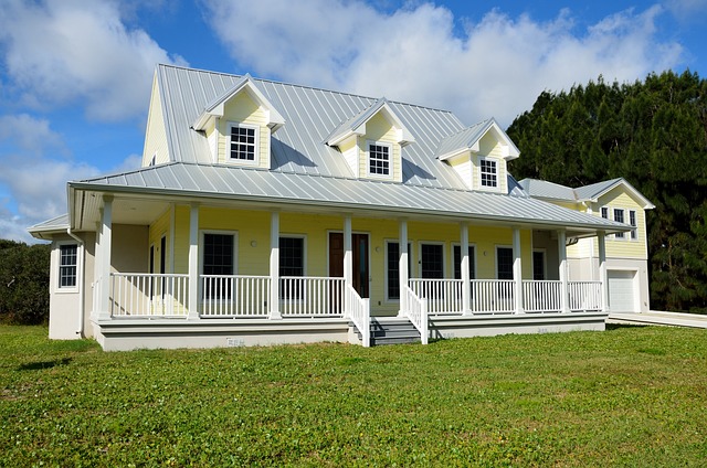 a large yellow house with a porch and a covered porch