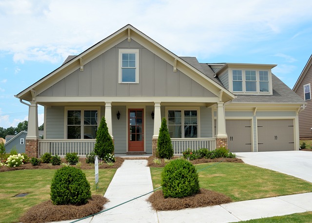 exterior of home with 2 car garage and red door