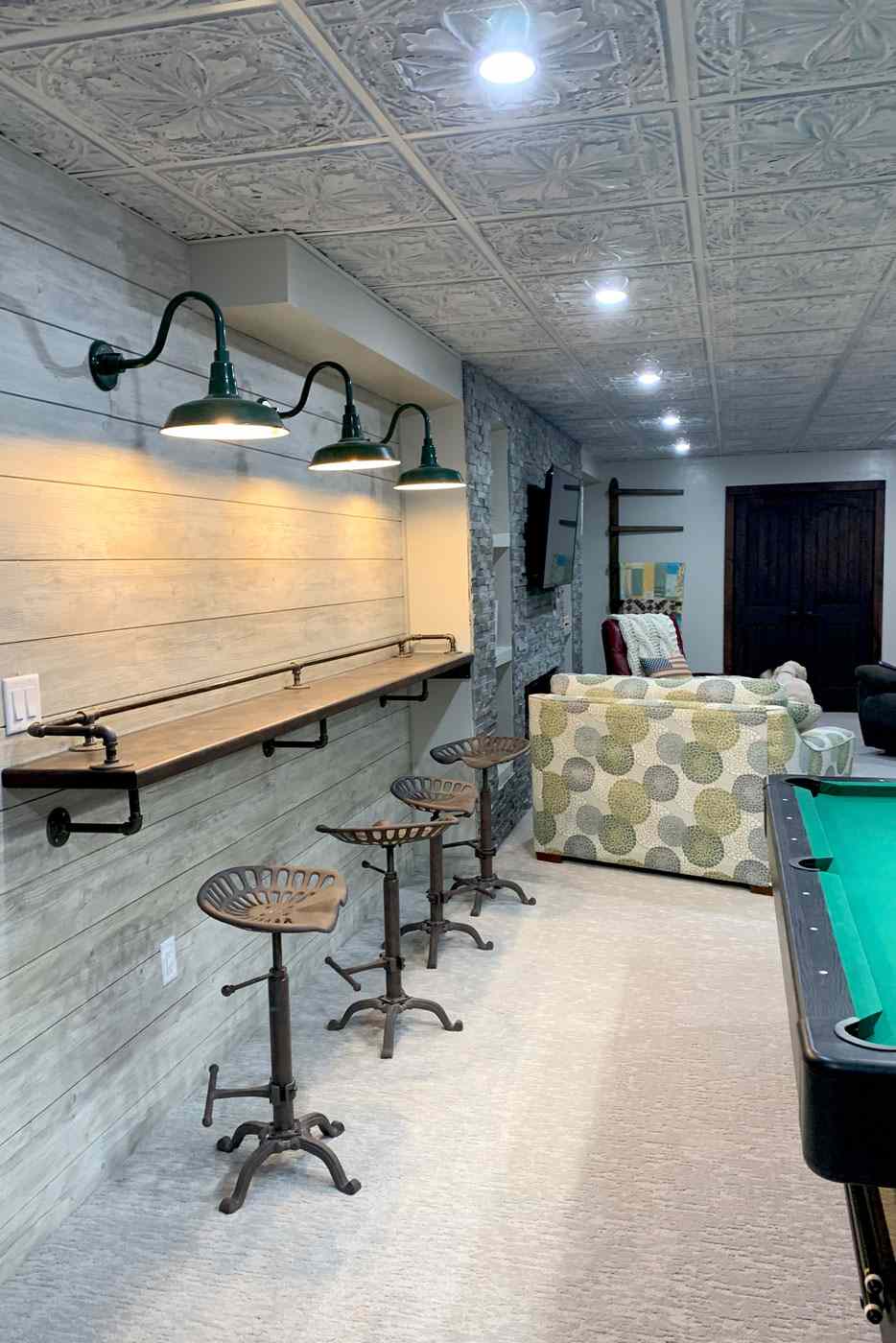 Basement space with industrial details & pool table by True Craft Remodelers, Central Illinois Basement space with industrial details & pool table by True Craft Remodelers, Central Illinois