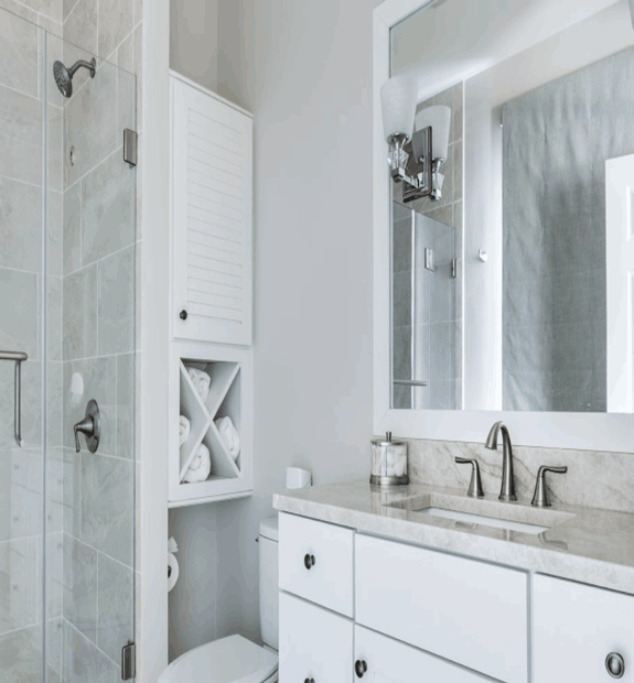 Small, white guest bathroom with chrome details by True Craft Remodeler, Central Illiniois
