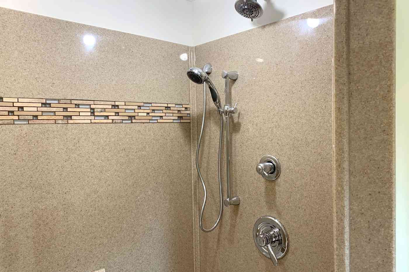 Large bathroom shower with tile detail by True Craft Remodelrs in Illinois