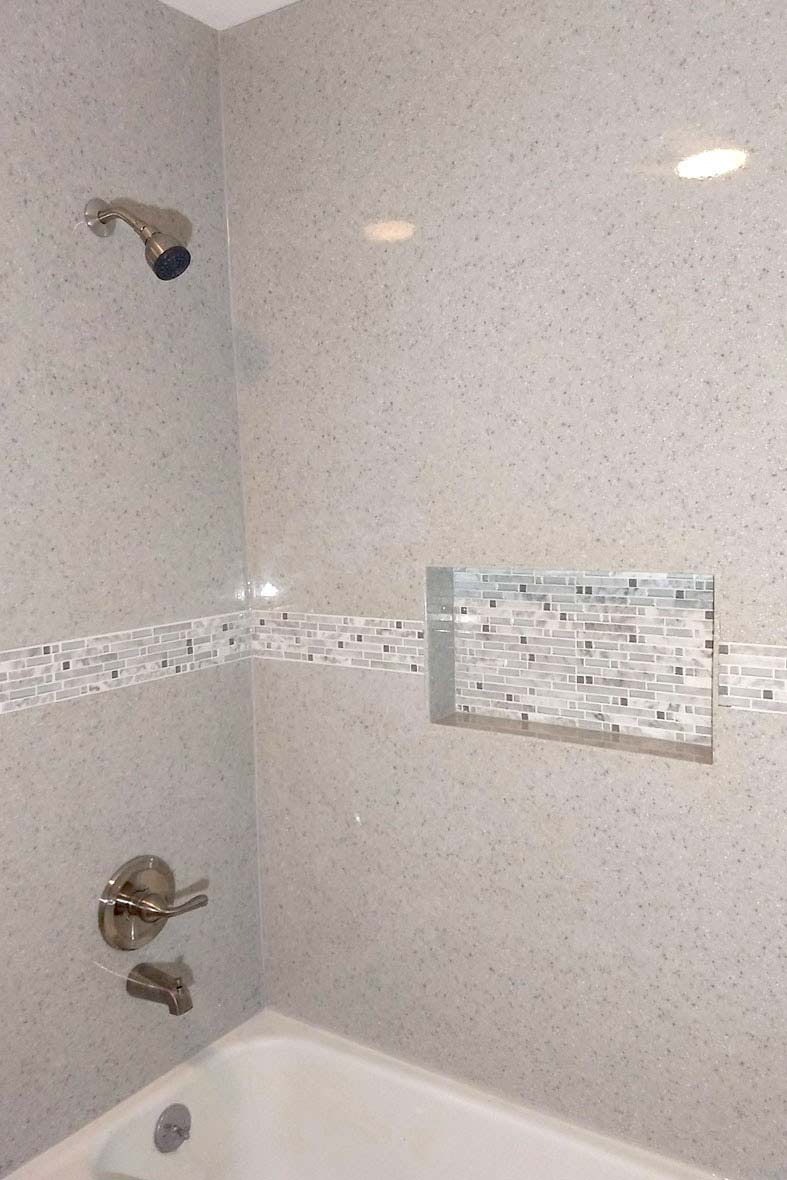 white shower with bath & mosiac tile detail by True Craft Remodelrs in Illinois